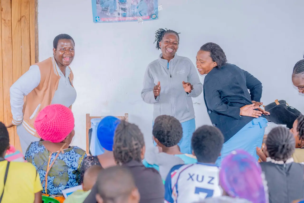 Members of the outreach team giving a health talk to women and children